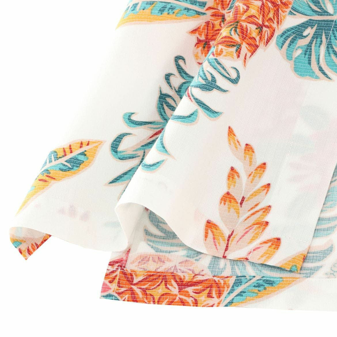 マンゴハウスのパイナップル柄かりゆしウェアに使用された接触冷感・生地感の拡大写真｜白地にトロピカルな南国モチーフ